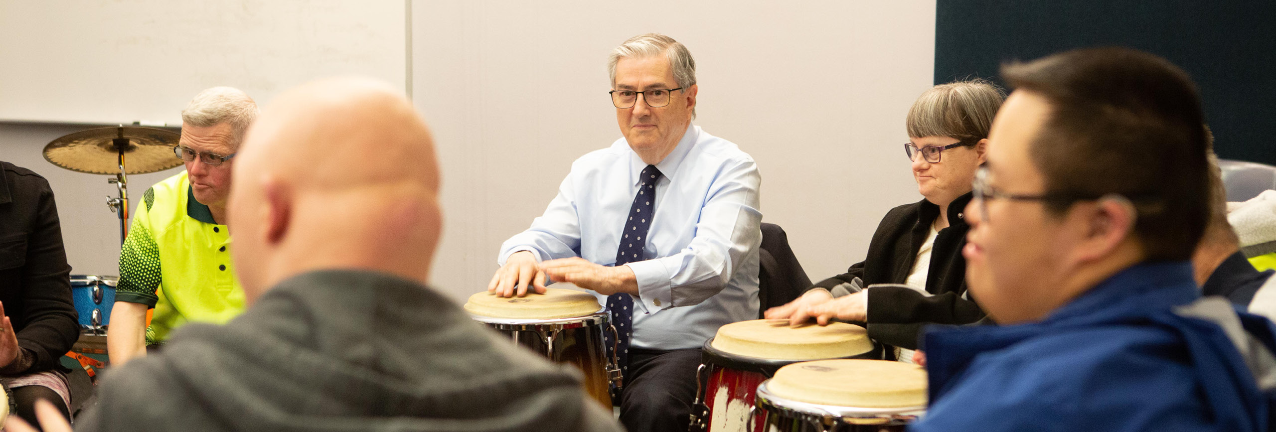 Mayor joins music therapy drumming class