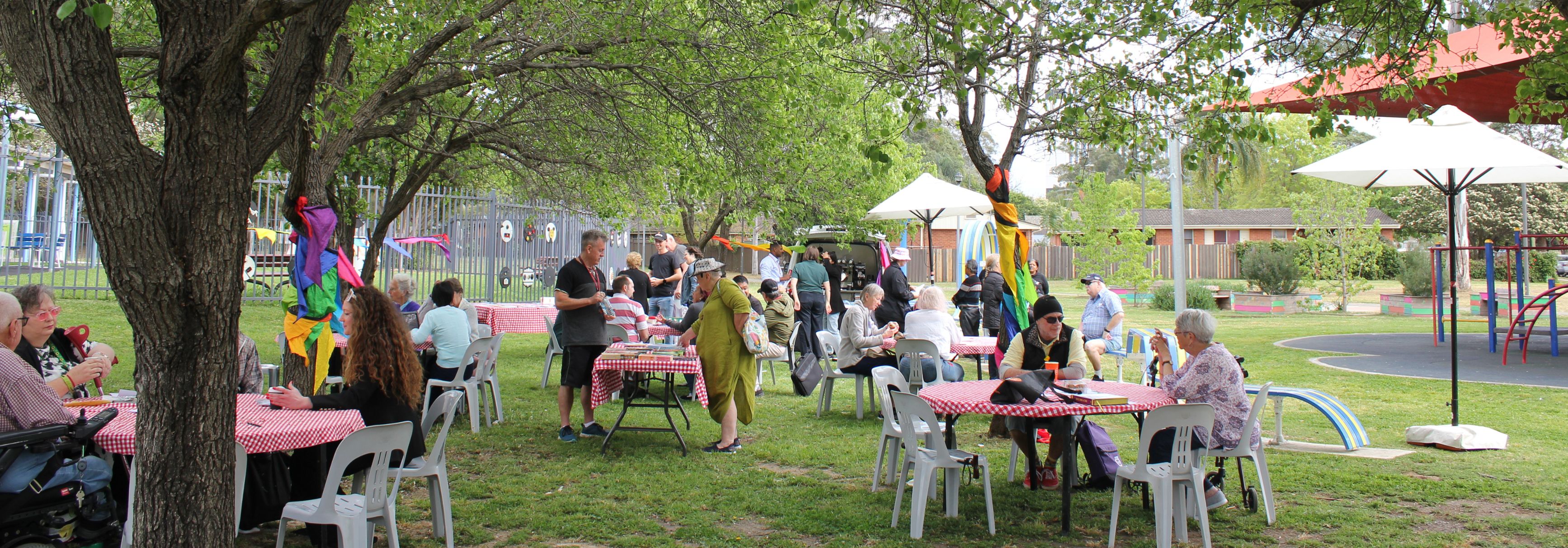 Group of people at outdoor cafe in park