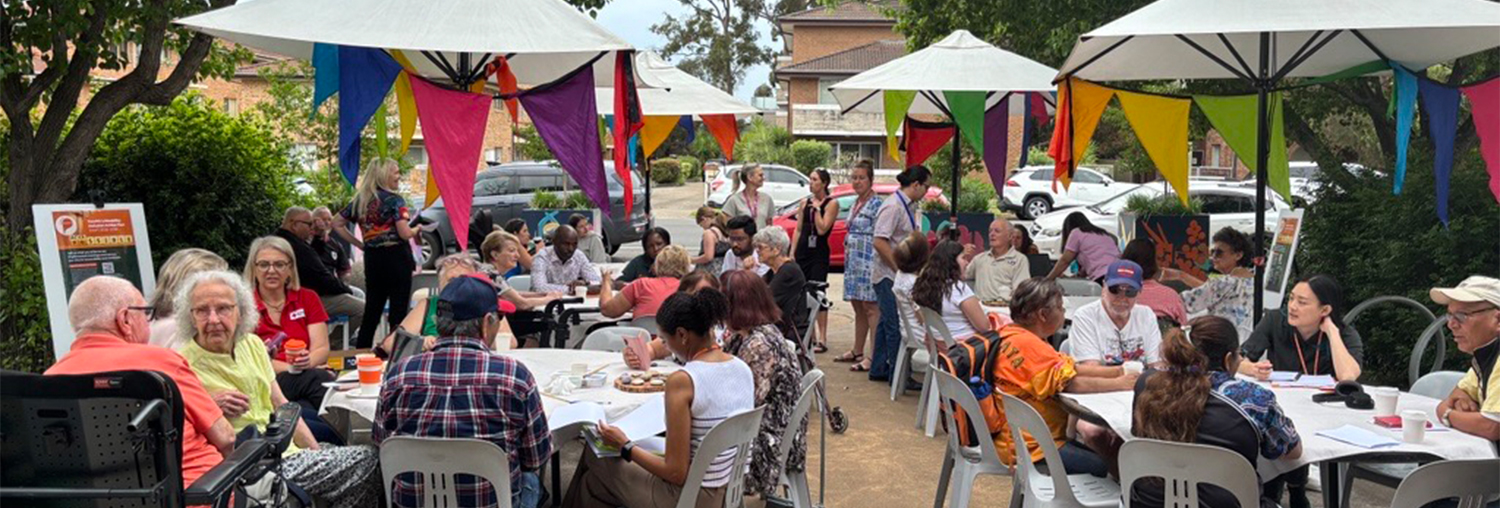 Group of people at outdoor cafe in park